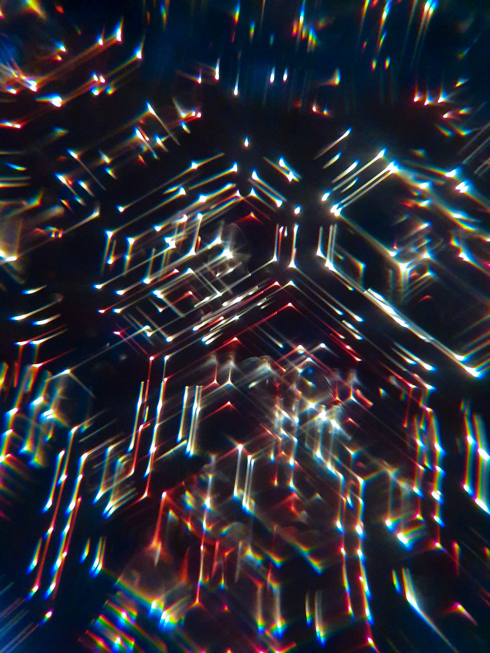 Soft focus lights, like fairy lights, on a dark background.